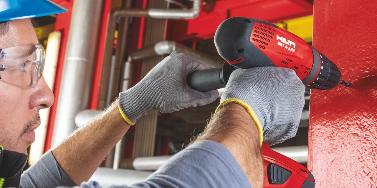 Pilot hole being drilled for an electrical connection